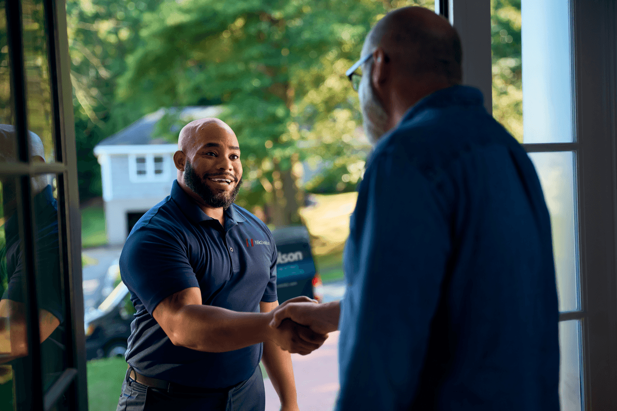 Technician shaking customers hand